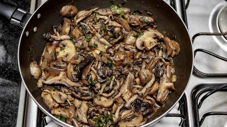pan of crowded sauteed mushrooms