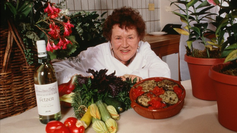 Julia Child smiling in her kitchen