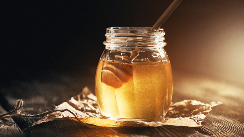 jar of honey and spoon