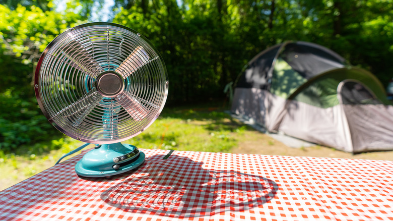 Fan on picnic bench