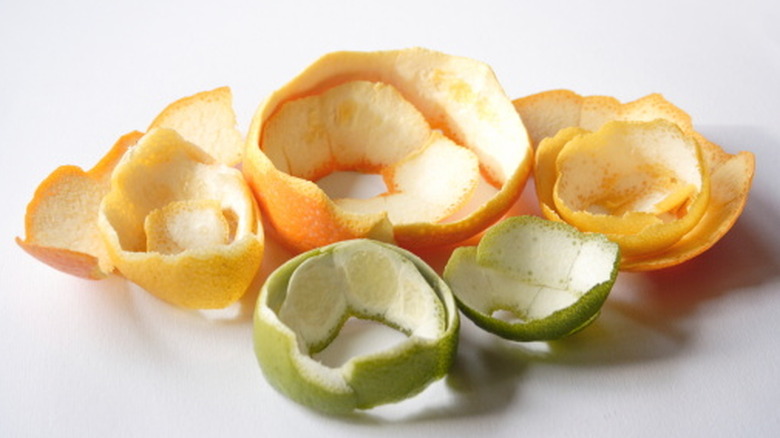 Various citrus peels on a white background