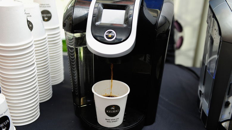 Keurig machine extracting coffee.