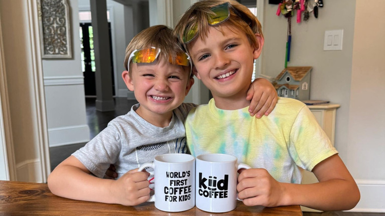 Ethan Sanborn and his brother with Kiid Coffee mugs