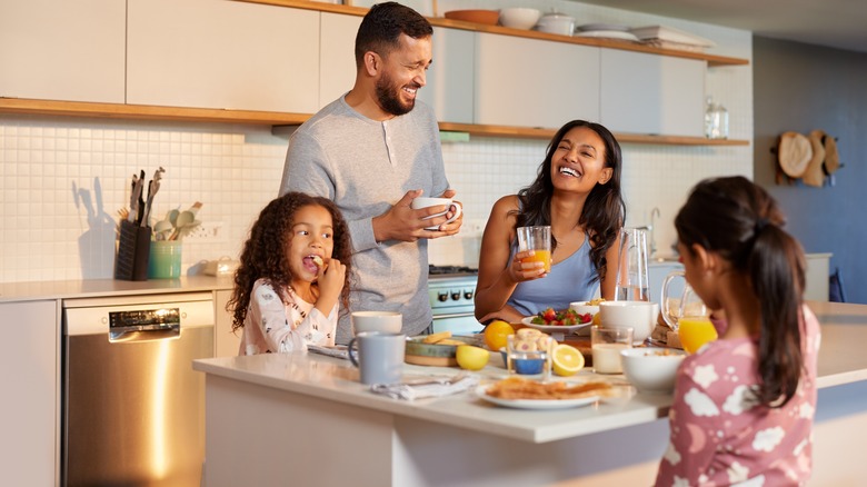 A family enjoying breakfast on a kitchen island