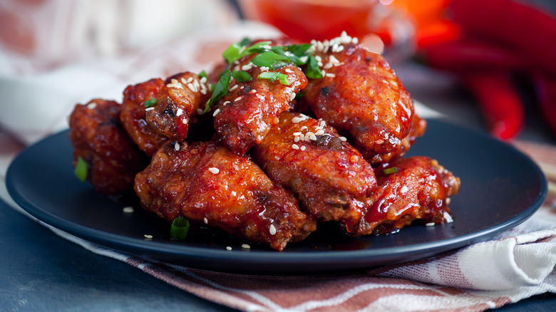 Plate of Korean fried chicken in gochujang sauce