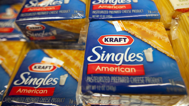 packages of Kraft Singles American processed cheese slices