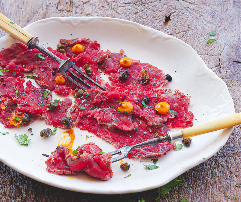 Generously season delicate slices of flash-seared lamb and serve with spicy harissa and crisped-up capers.