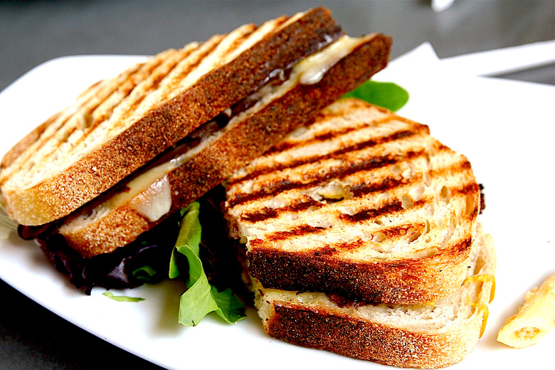 Panini is actually the plural of panino, or one grilled sandwich. We prefer panini because it means there's more than one.