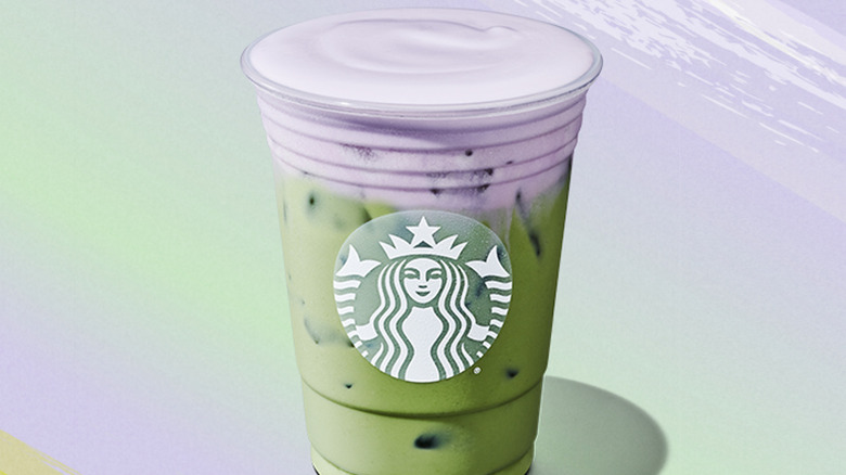 iced lavender cream oatmilk matcha in a starbucks cup