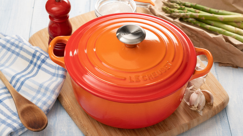 An orange Le Creuset Dutch oven.