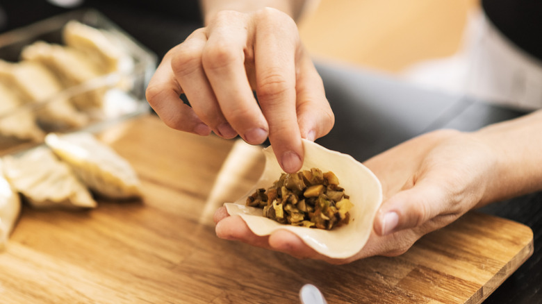 A person making dumplings