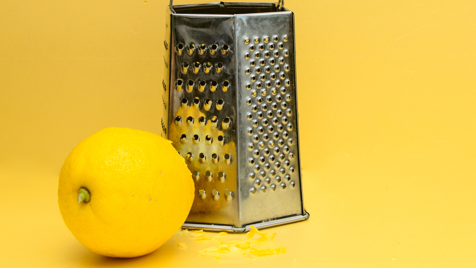 Lemon Is The Secret To Cleaning Cheese Graters Without Shredding Sponges