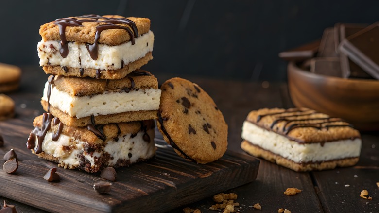 Stacked ice cream sandwiches next to a cookie