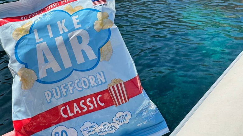 Like Air bag held in front of body of water