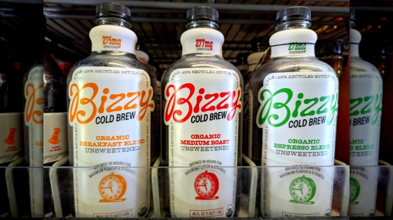 Rows of Bizzy Cold Brew coffees sit in a grocery store's cold case