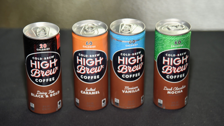 A selection of High Brew cold brew coffee cans sit on a gray counter