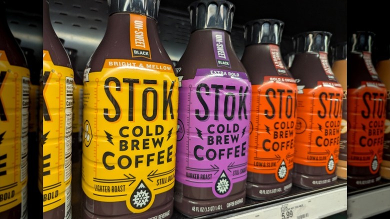 Rows of Stok Cold Brew coffee bottles sit on a grocery store's shelf