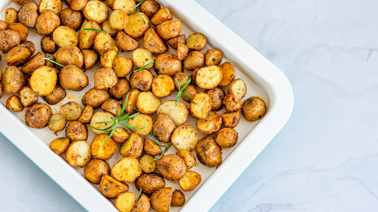 Baking dish with seasoned roasted potatoes