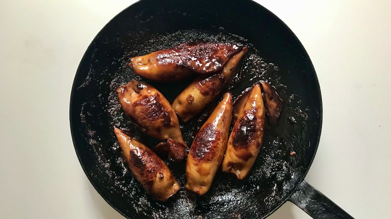 browned stuffed squid in pan