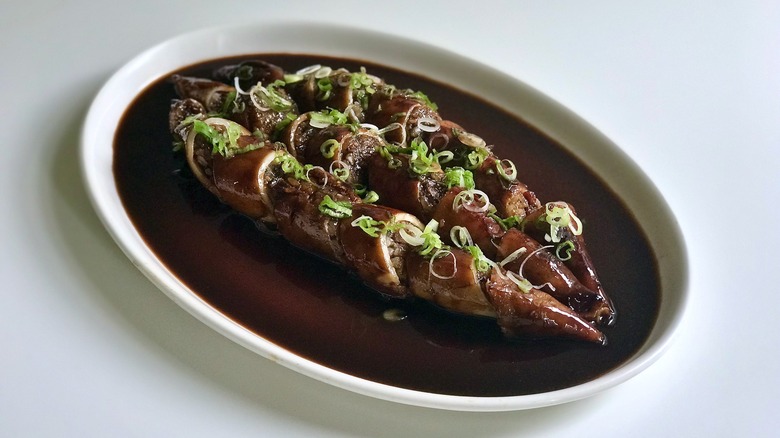 sliced stuffed squid on plate