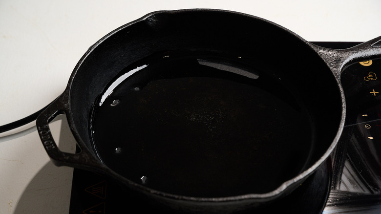 heating oil in a skillet