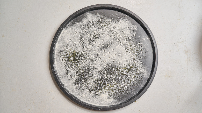 pizza stone dusted with flour