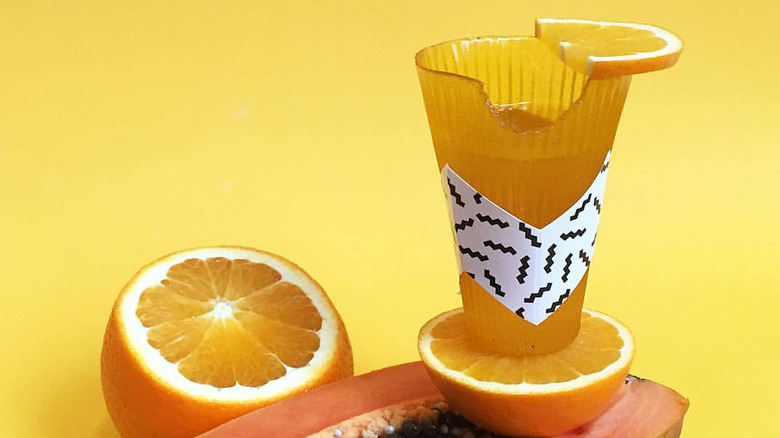 Loliware orange edible cup with citrus and papaya fruits