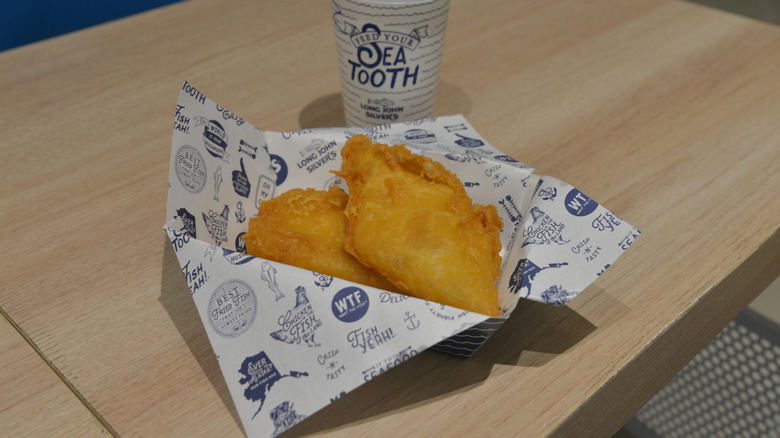 Long John Silver's fish sits in a tray on a table
