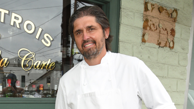 Ludo Lefebvre smiling outside of a restaurant