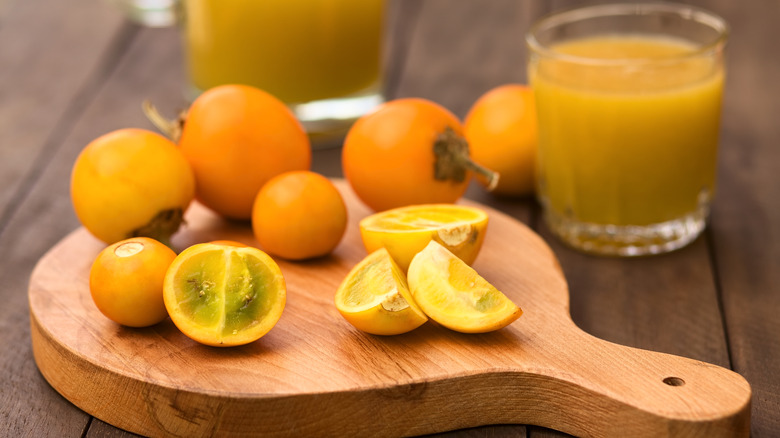 Lulo fruits on a wooden board