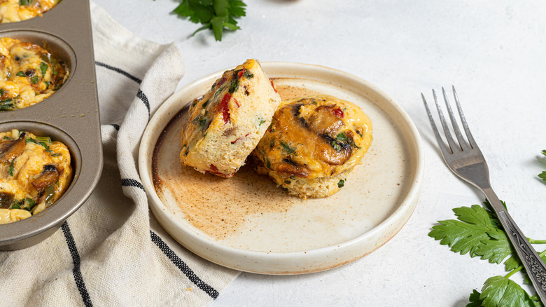 Plate with two mushroom egg bites and a fork on the side
