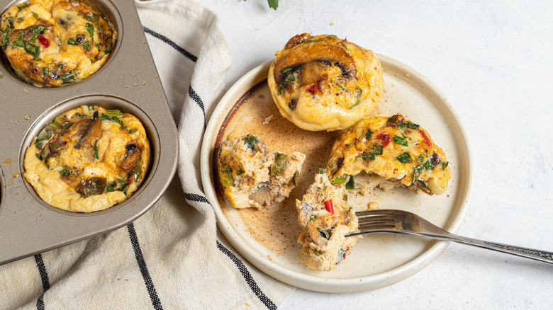 Plate with mushroom egg bites and a fork in one of them
