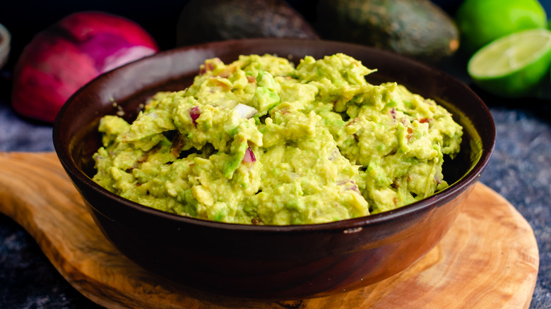 guacamole in a dark bowl
