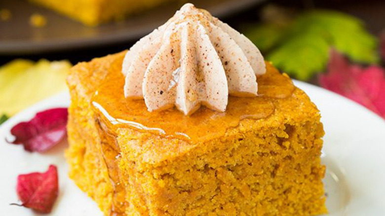 Homemade cinnamon honey butter on top of a slice of pumpkin cornbread