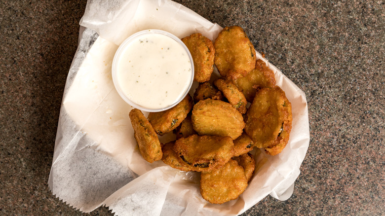 fried pickles served in basket.