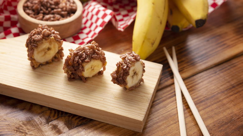 Banana slices wrapped in peanut butter and puffed rice cereal