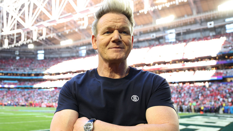 Gordon Ramsay smiling in a baseball stadium