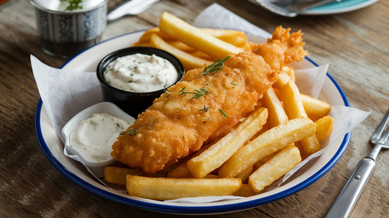 A plate of fish and chips with tartar sauce