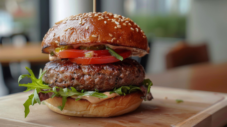 Hamburger featuring juicy burger patty