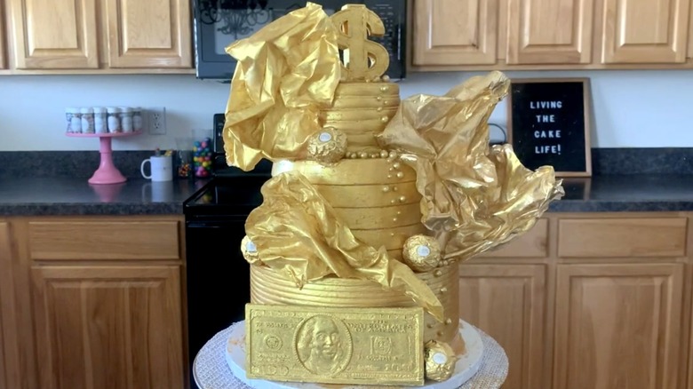 Golden metallic cake on counter