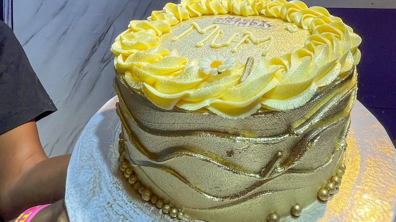 Birthday cake with metallic gold frosting