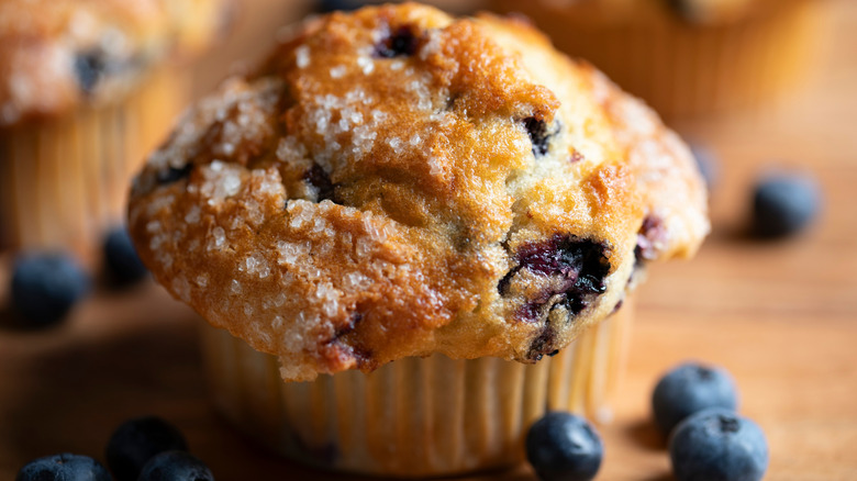 Closeup of a blueberry muffin with coarse sugar on top