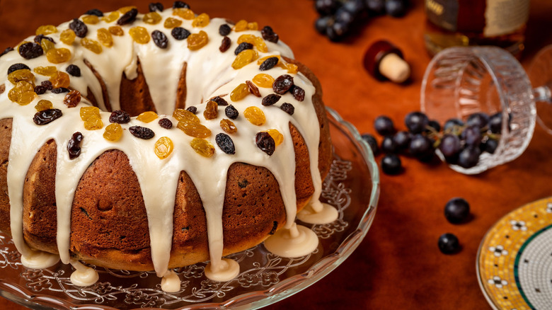 A rum raisin bundt cake on a platter