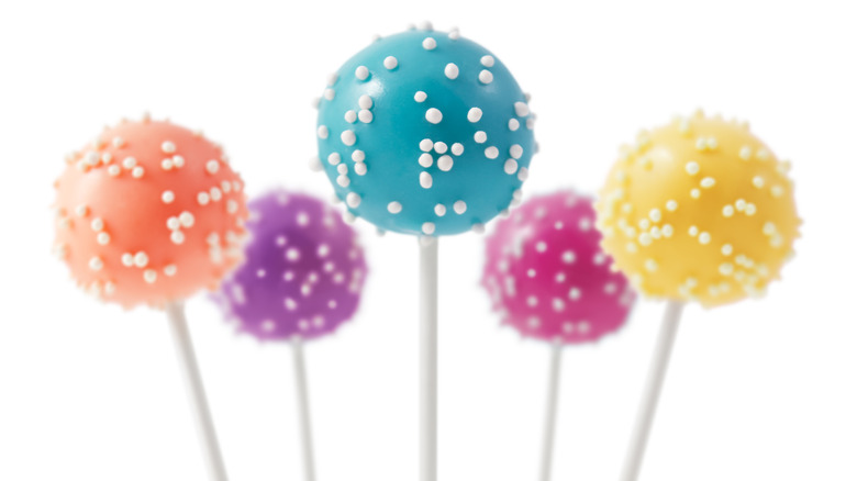 Colorful cake pops with white sprinkles