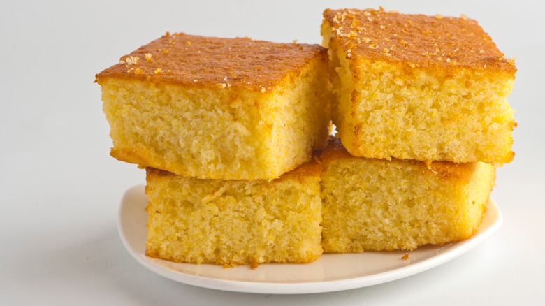 Pieces of golden corn bread stacked atop each other