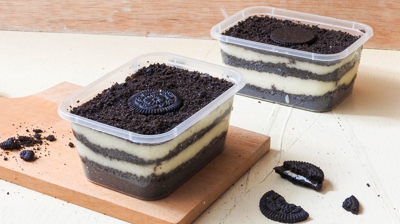 Oreo cookie layer cakes in plastic containers