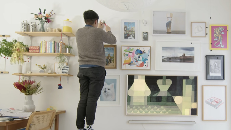 Someone installs a gallery wall in their home