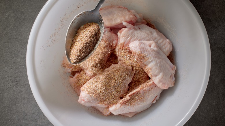 Seasoning raw chicken wings
