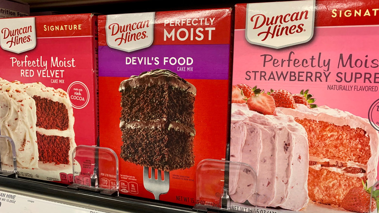 Duncan Hines cake mixes sit on a grocery store shelf