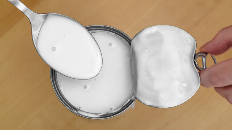 Opened can of coconut milk.